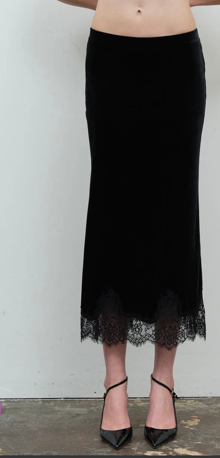 Front view of the black long skirt with a sheer lace hem