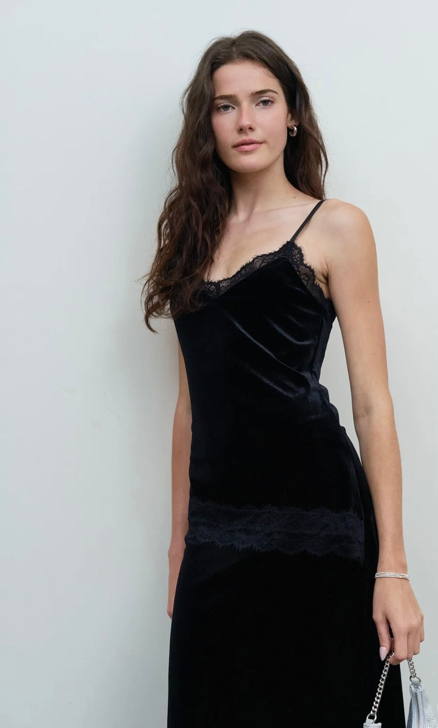 Black velvet camisole with lace neckline and hem, paired with a long skirt