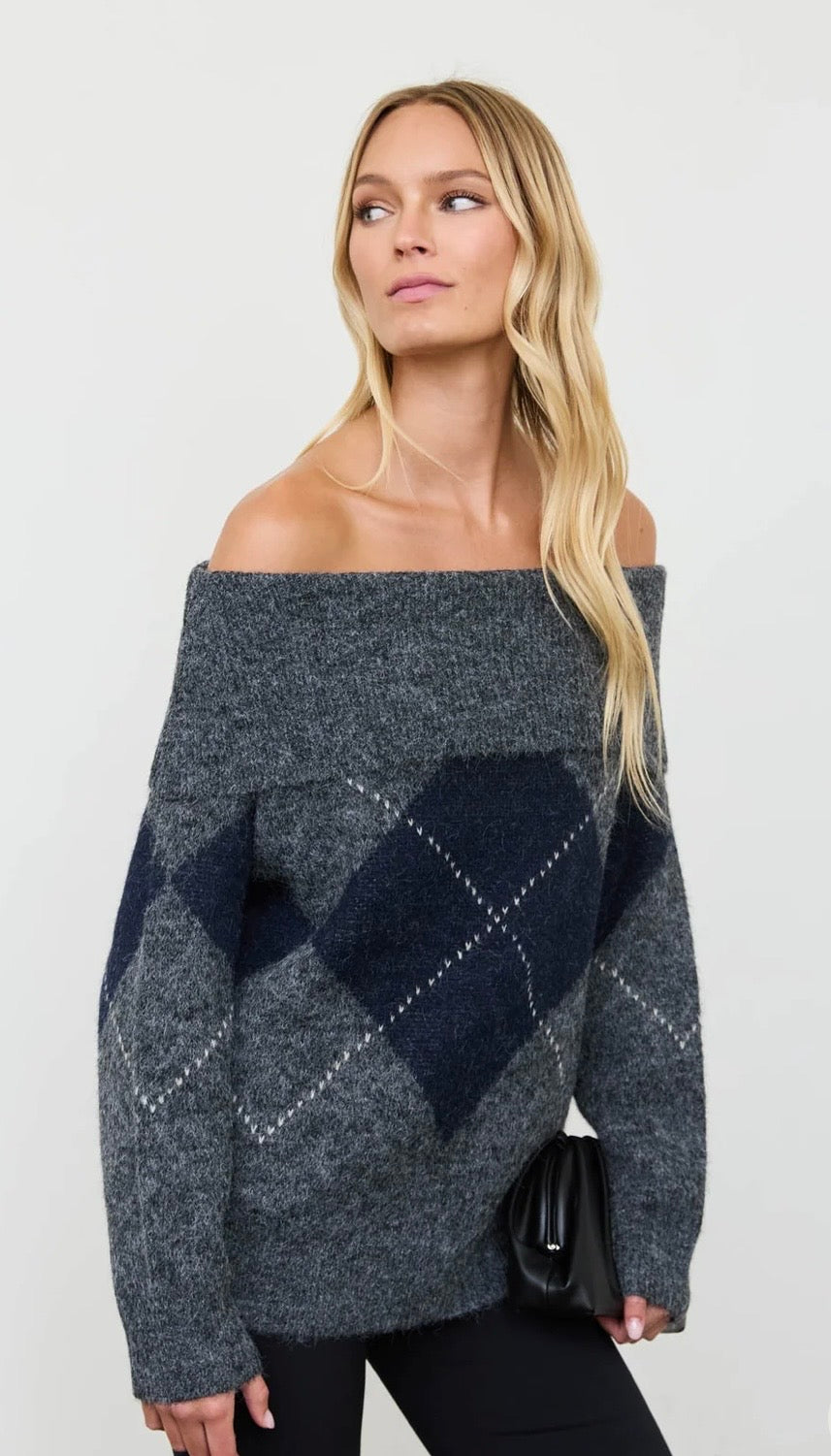 Charcoal gray off-the-shoulder sweater with navy argyle pattern and oversized sleeves